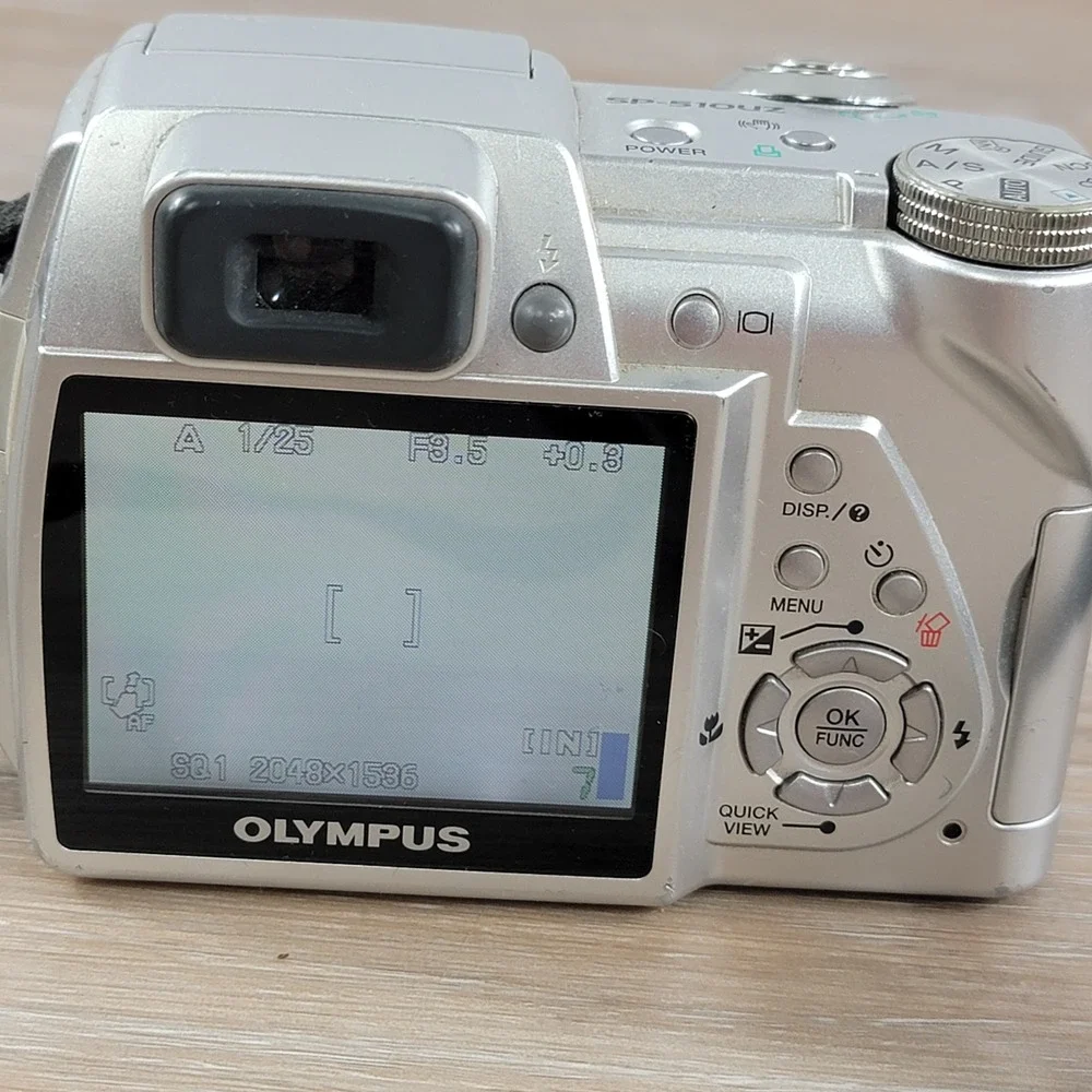 Olympus SP-510UZ 7.1 Megapixel Digital Camera 10x Optical Zoom Silver No Cap